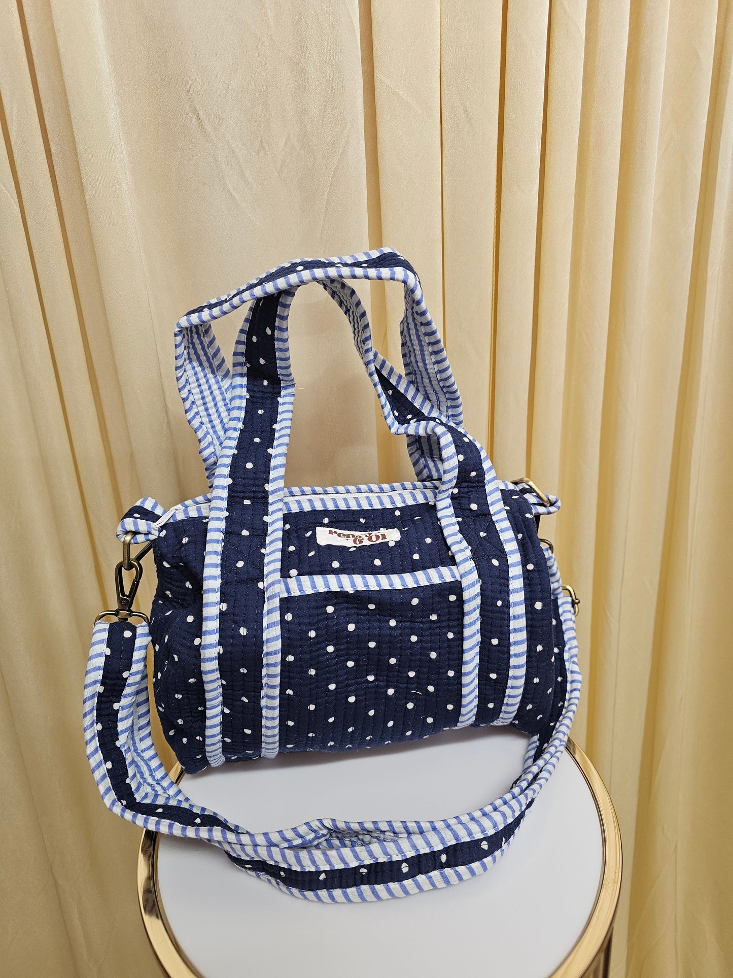 Navy polka dots mini duffle bags