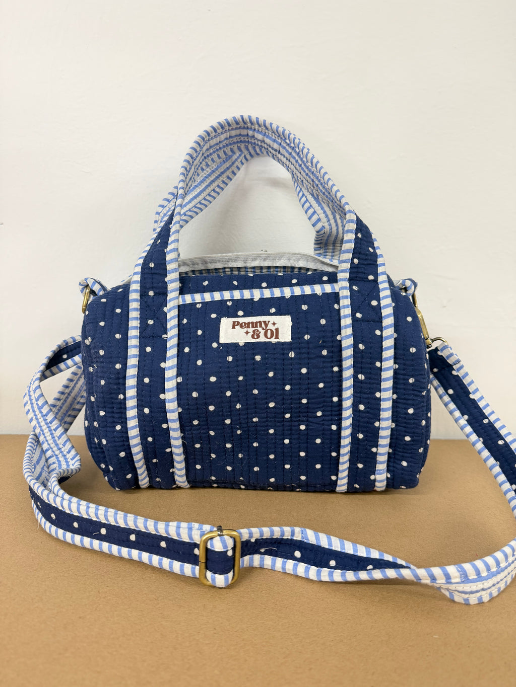 Navy polka dots mini duffle bags