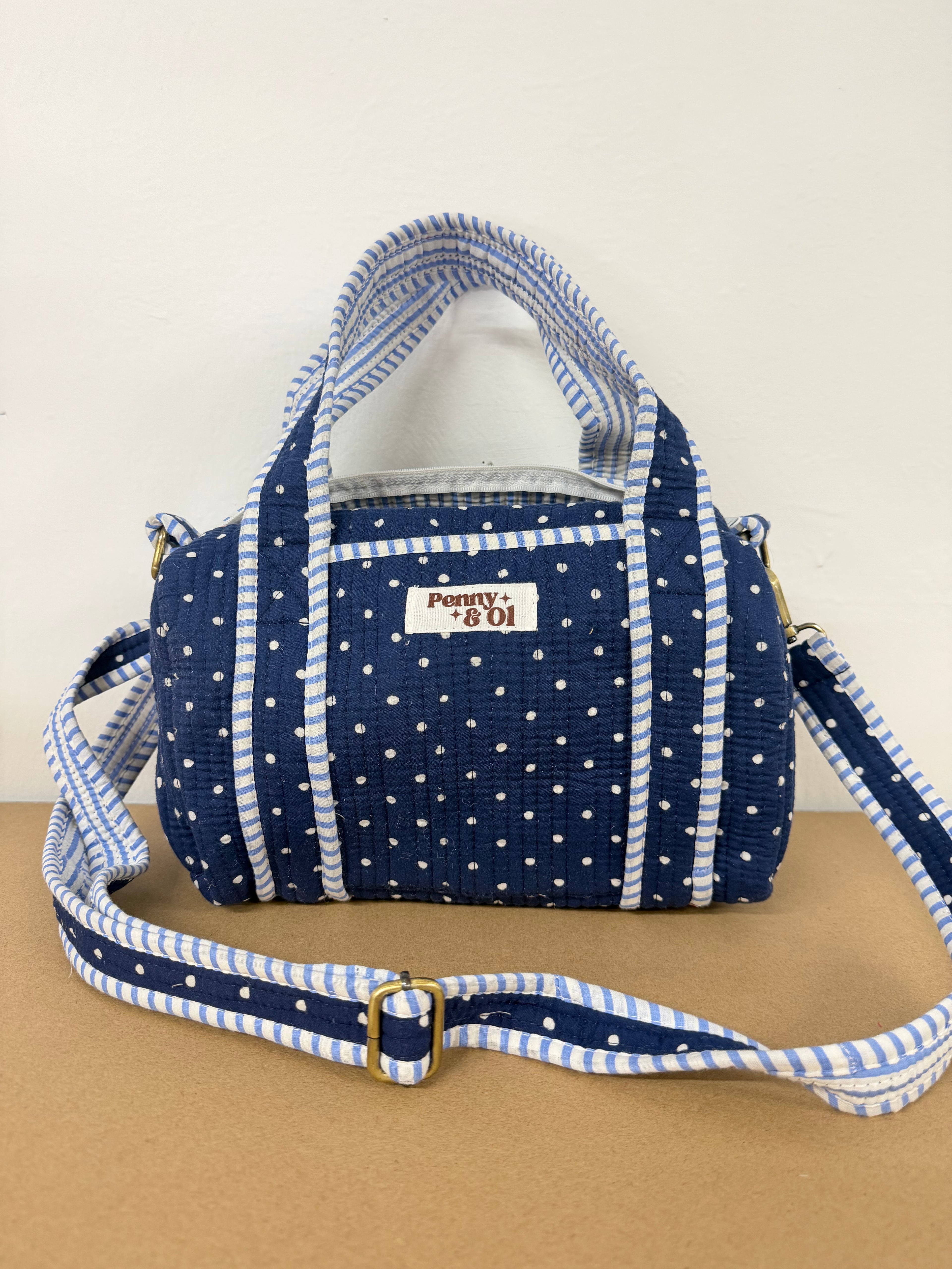 Navy polka dots mini duffle bags