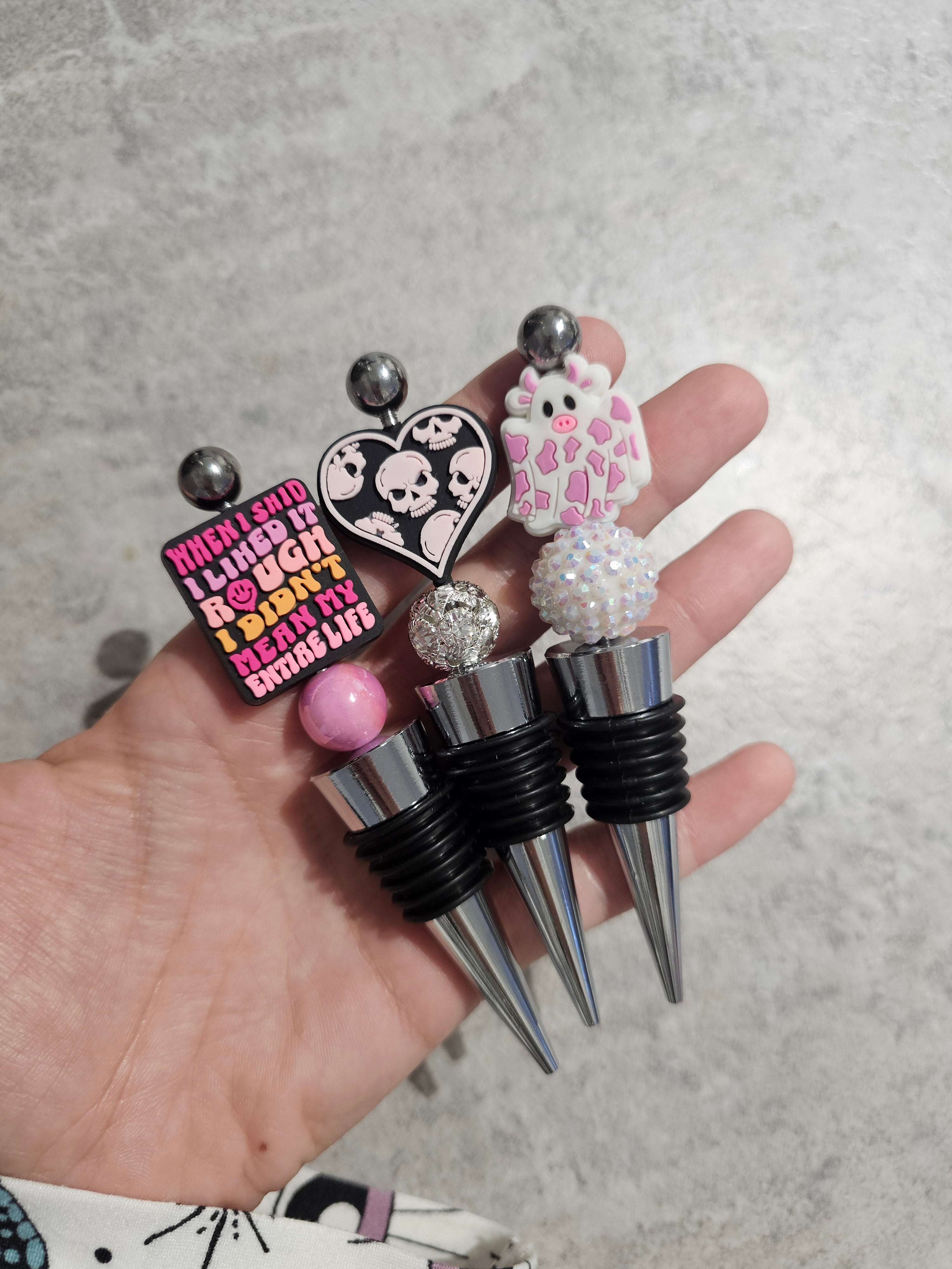 Beaded wine stopper. Only 1 of each available.