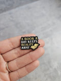 A book a day keeps reality away Pin Badge