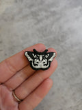 Black and white moth, shoe charm