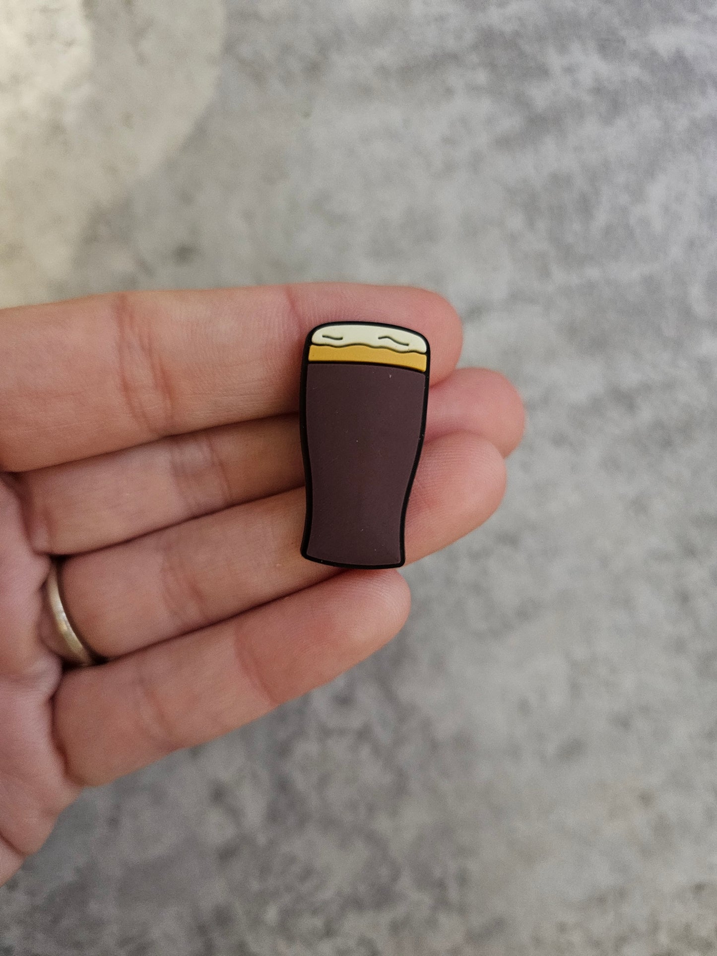 Brown beer glass, shoe charm