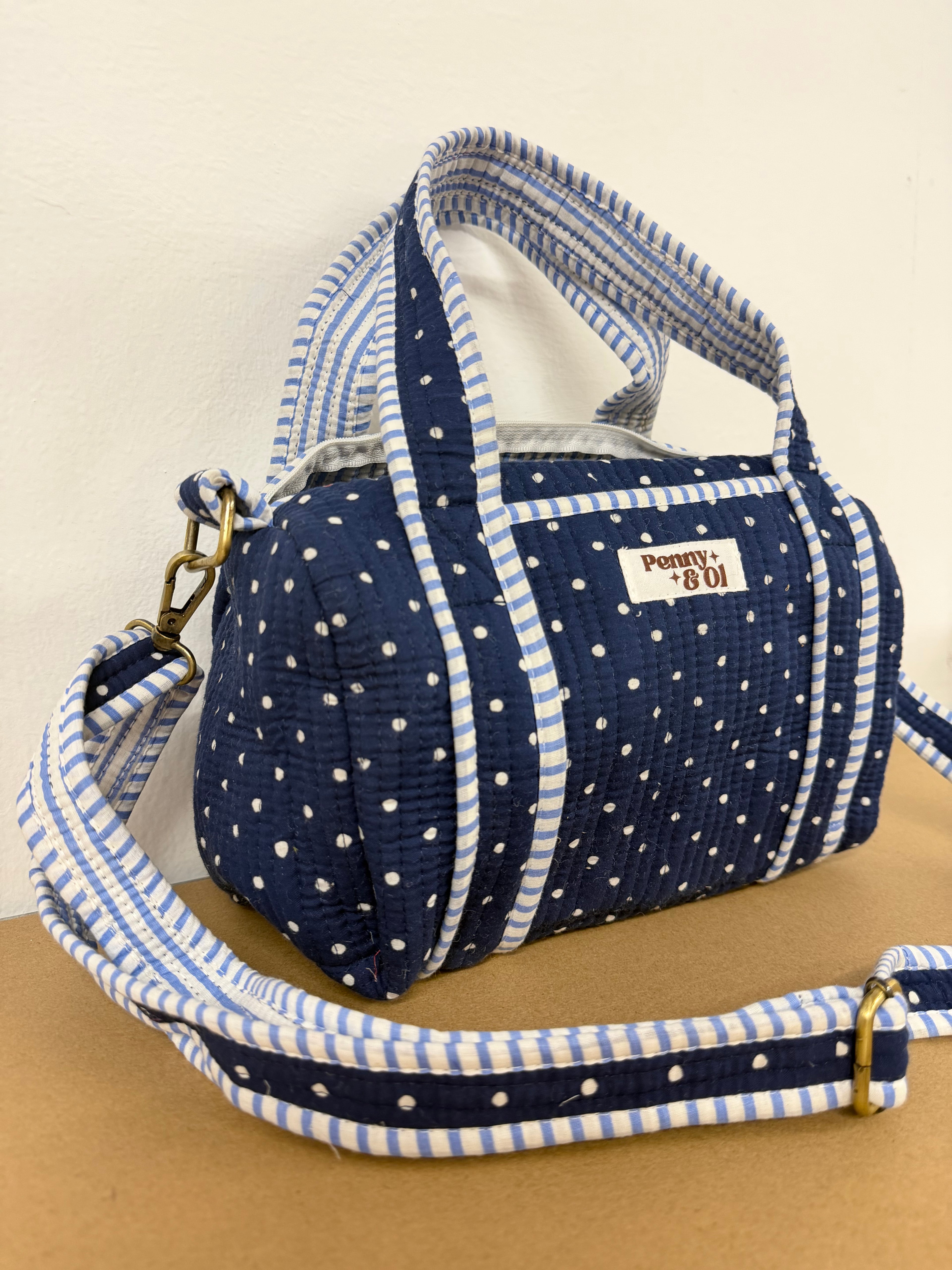 Navy polka dots mini duffle bags