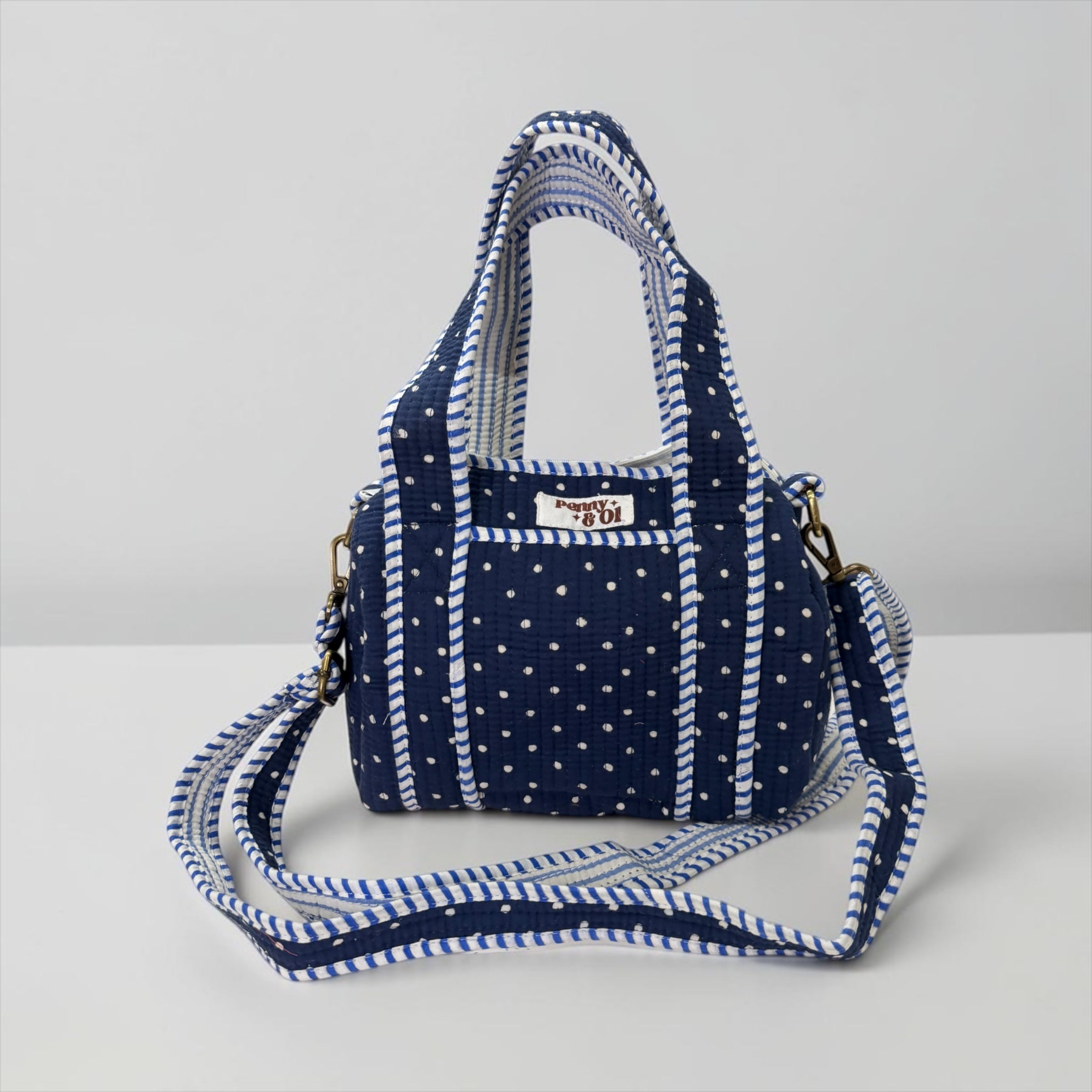 Navy polka dots mini duffle bags