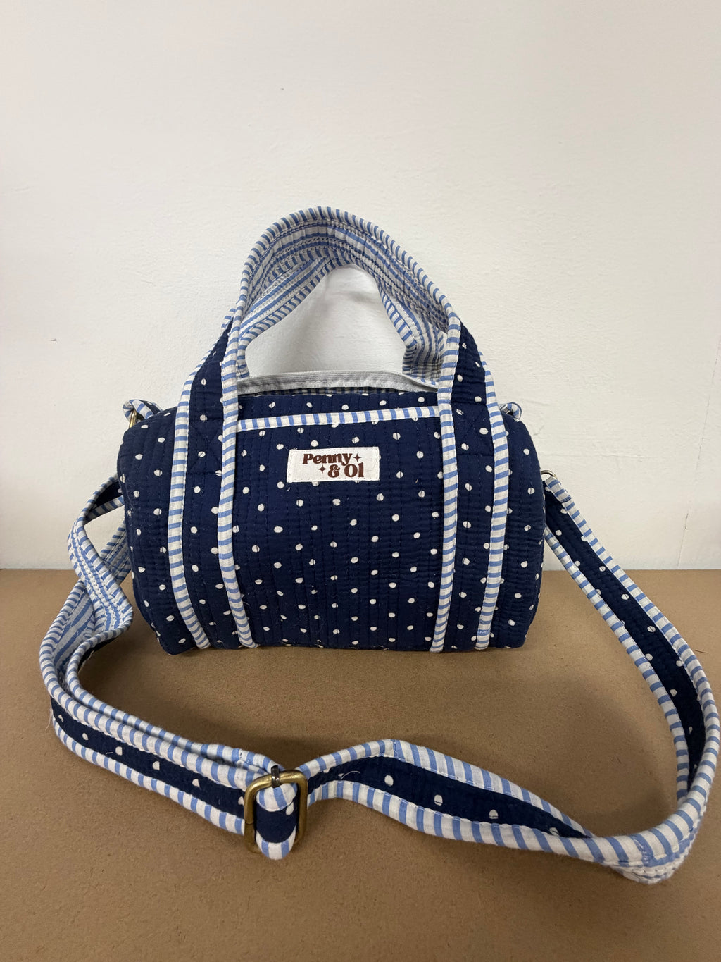 Navy polka dots mini duffle bags