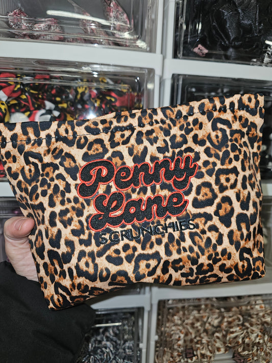 Red leopard embroidered pouch, imperfect.