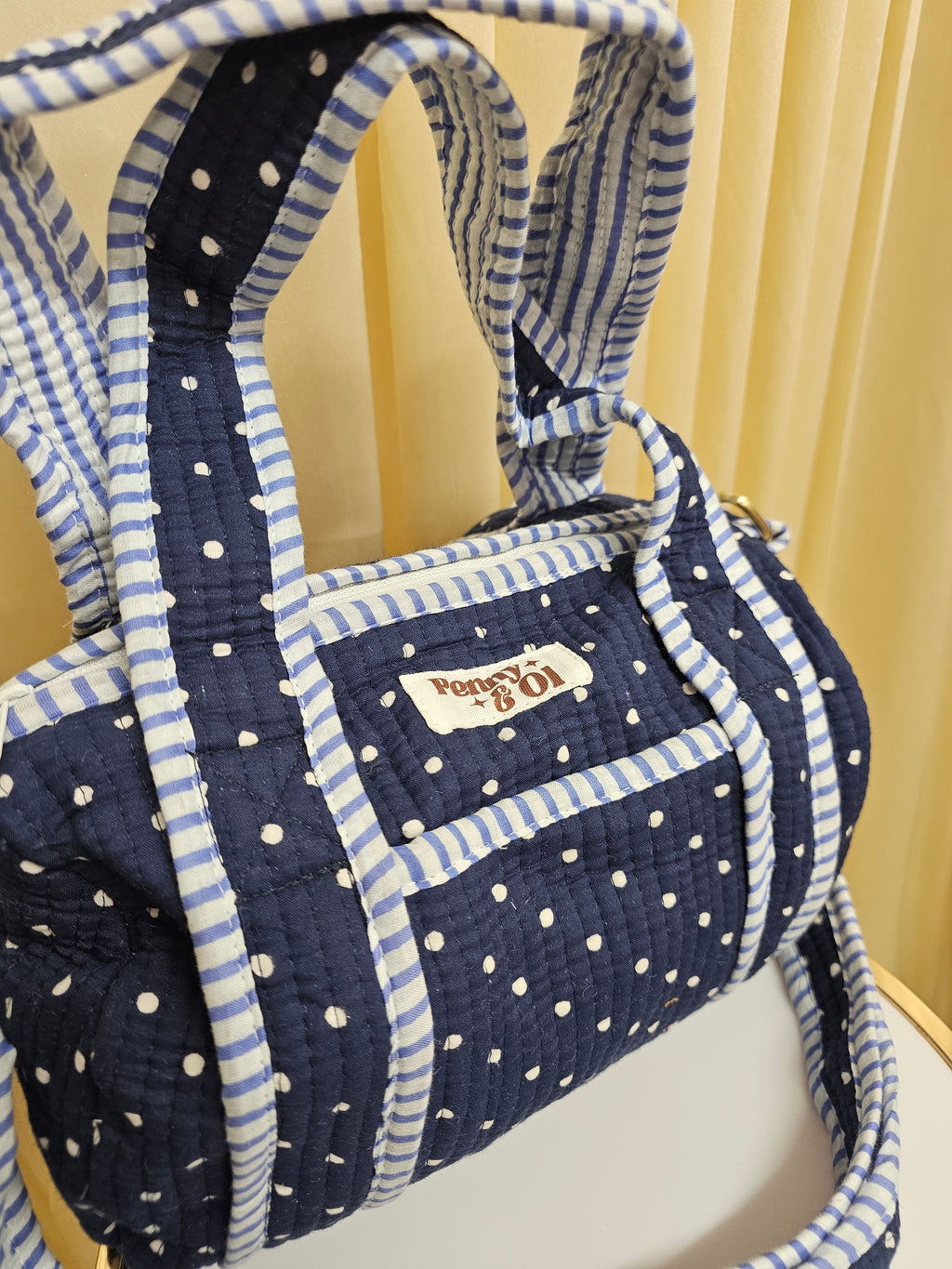 Navy polka dots mini duffle bags