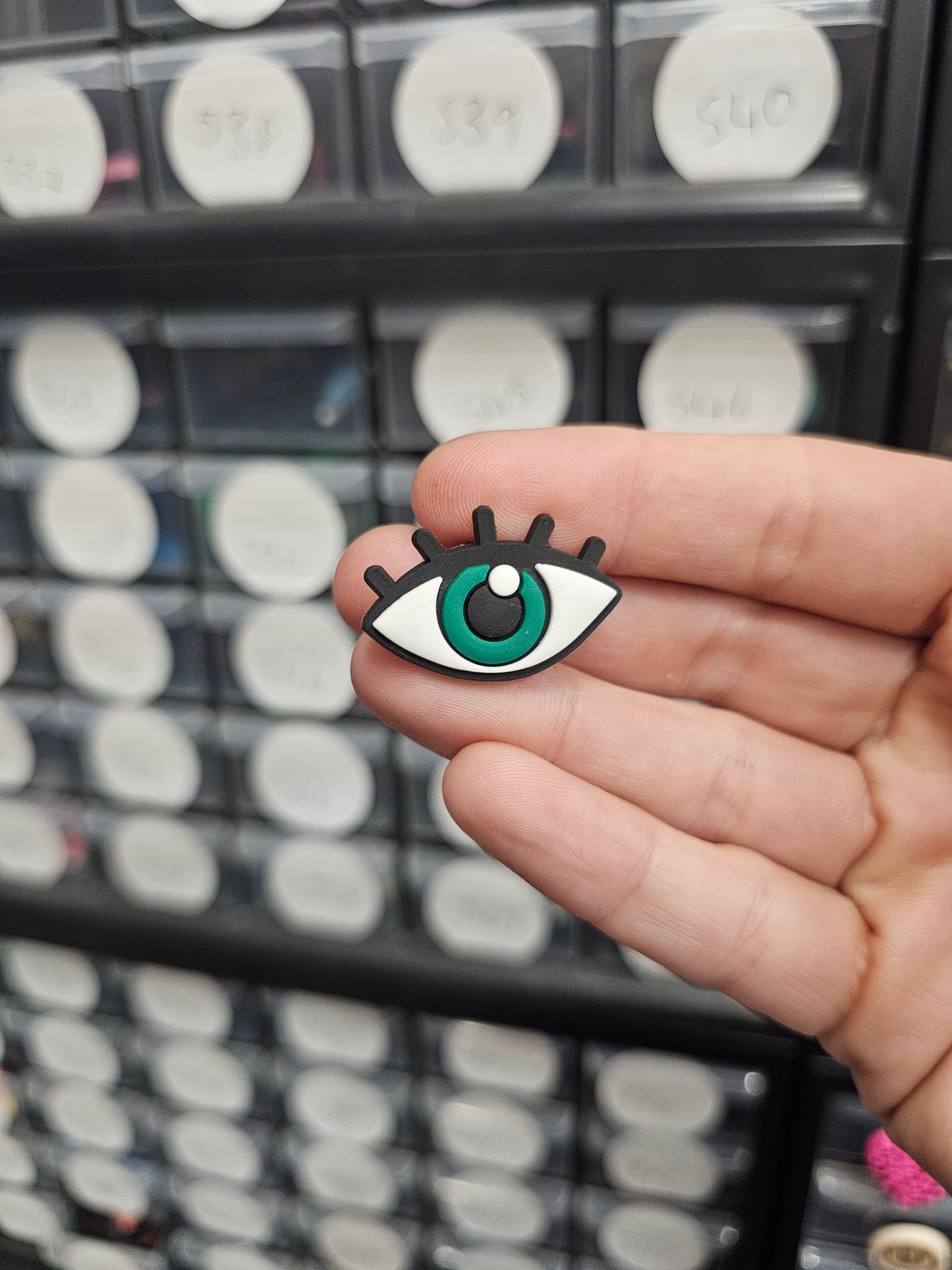 Green eye with lashes shoe charm