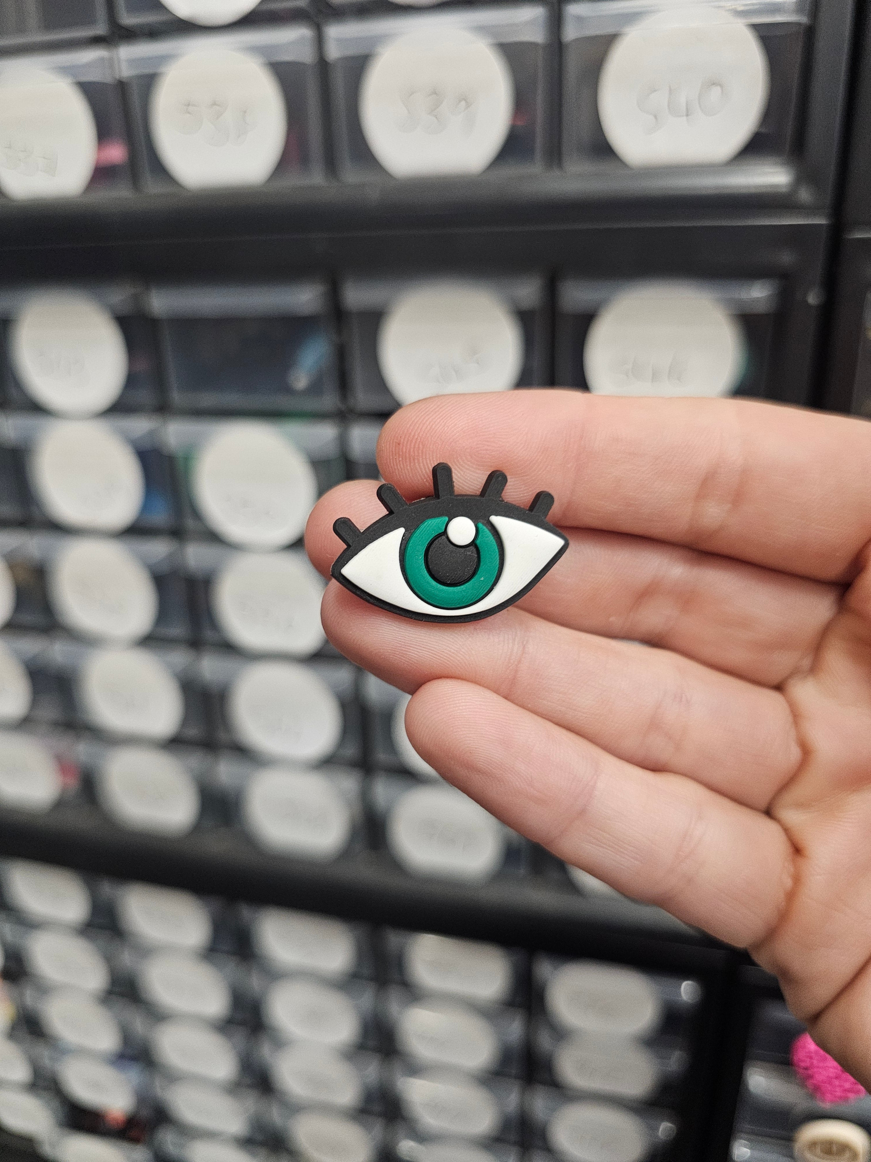 Green eye with lashes shoe charm