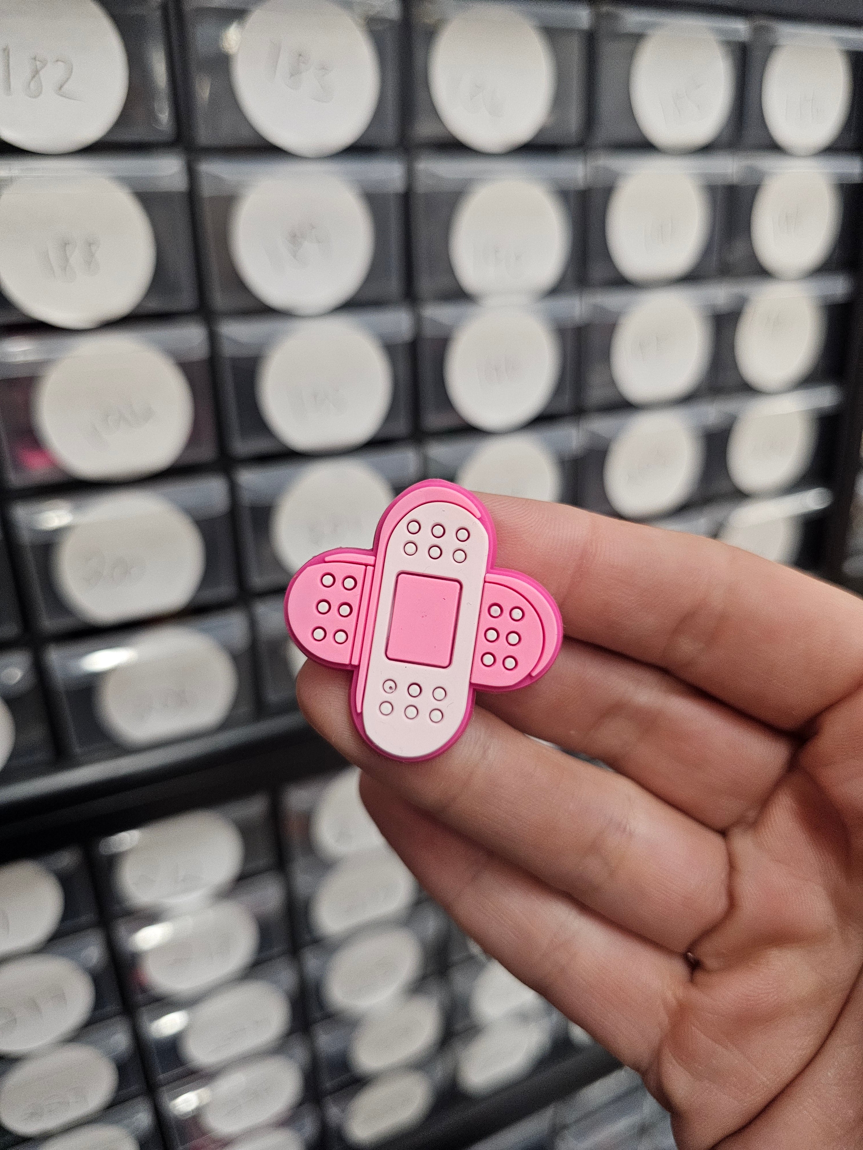Pink plasters shoe charm