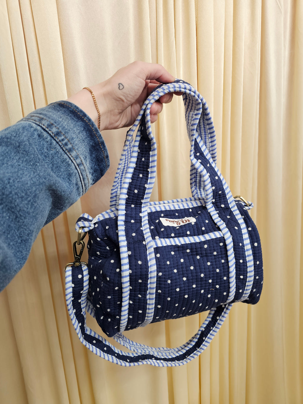 Navy polka dots mini duffle bags