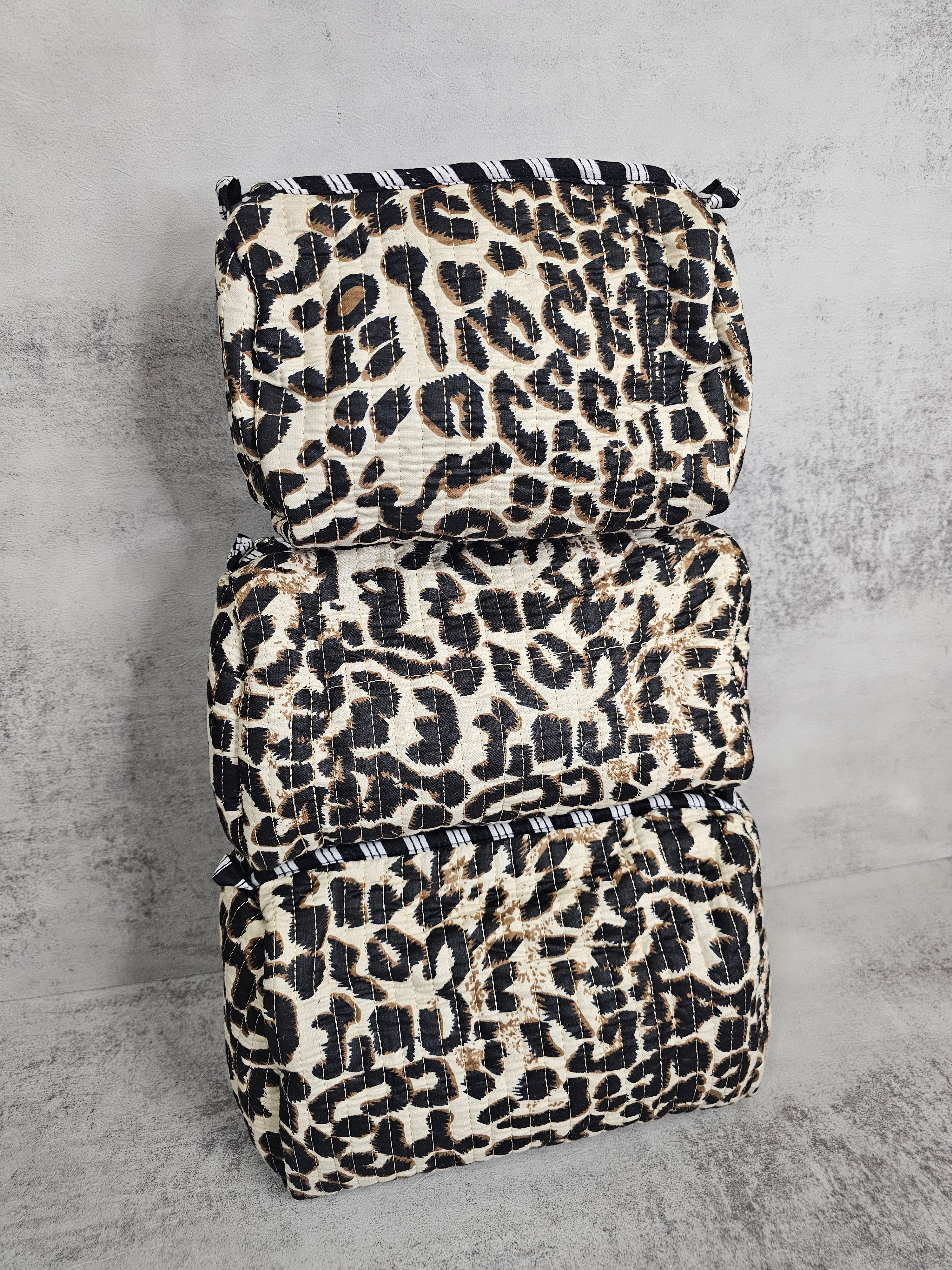3 pack  waterproof pouches, all prints. 3 peice set